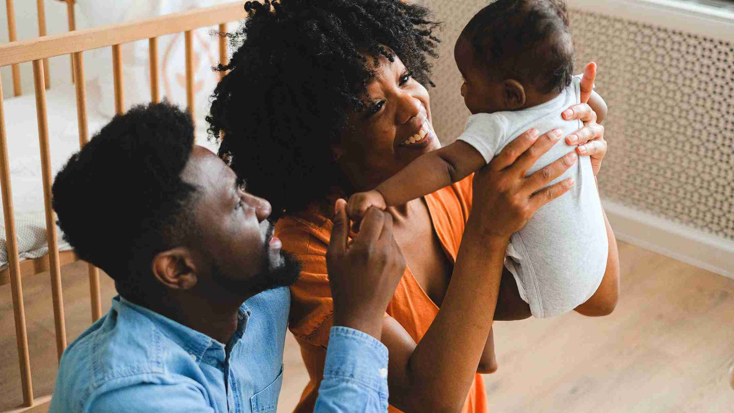 mom holding baby with dad | bamboobies