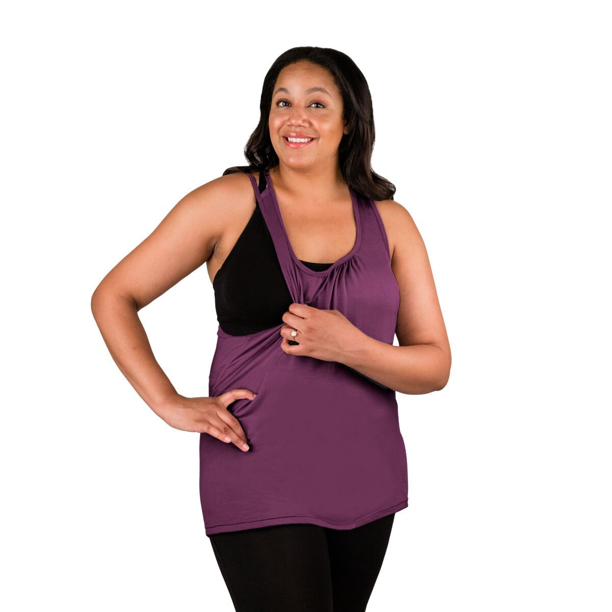 Woman wearing purple nursing tank top, pulling side over showing nursing feature