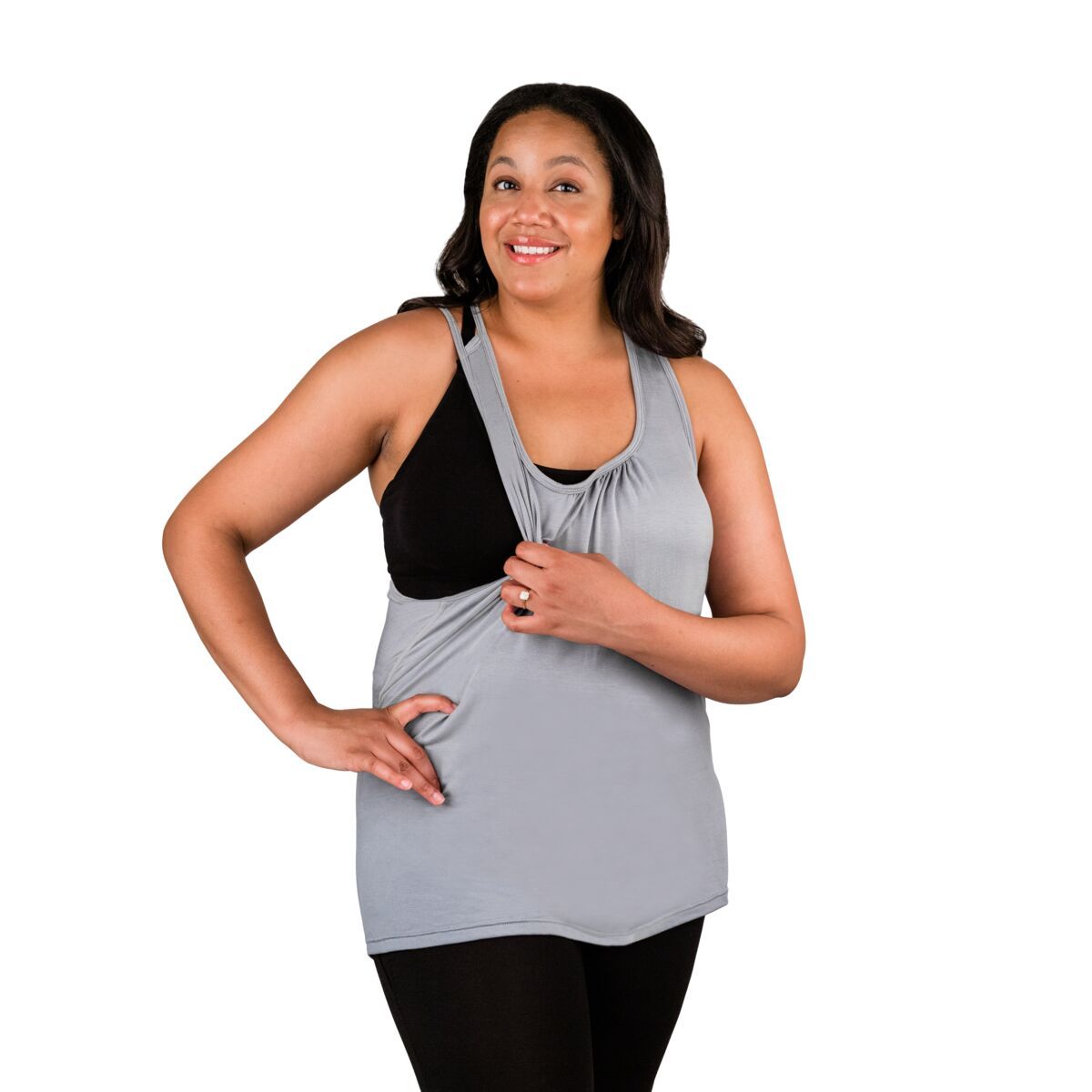 Woman wearing grey nursing tank top, pulling side over showing nursing feature