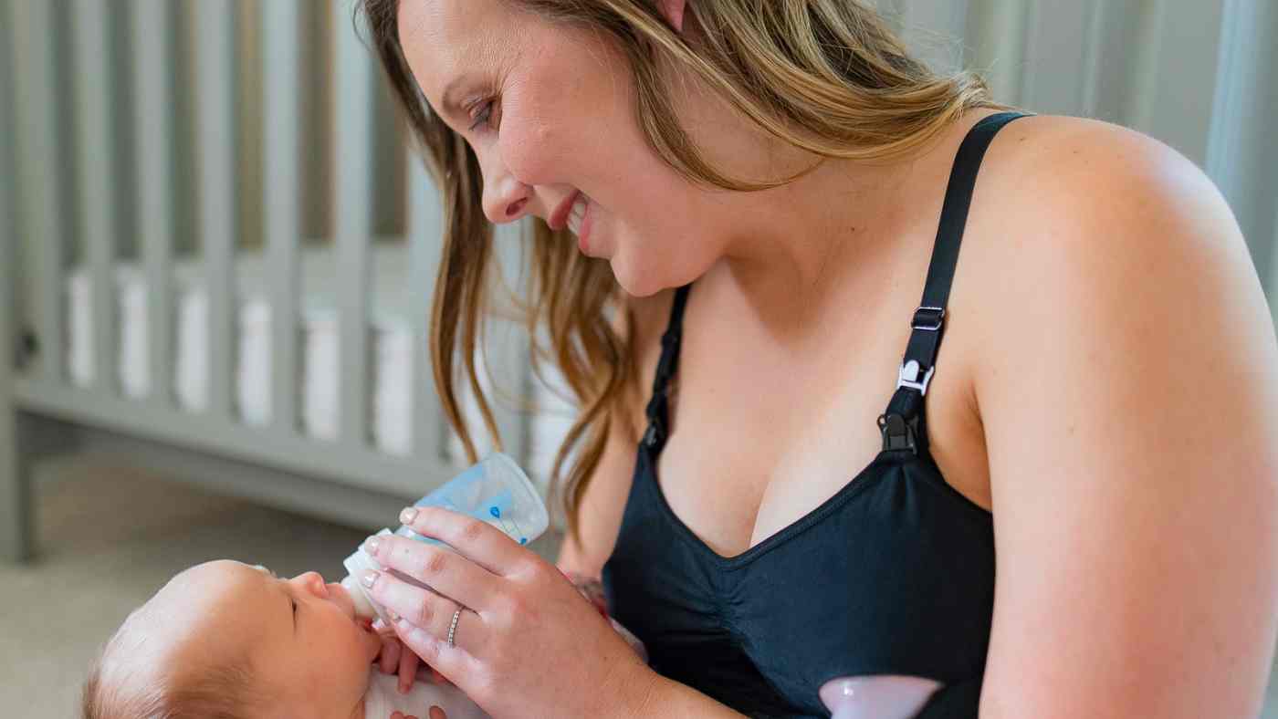woman wearing bamboobies bra feeding her baby